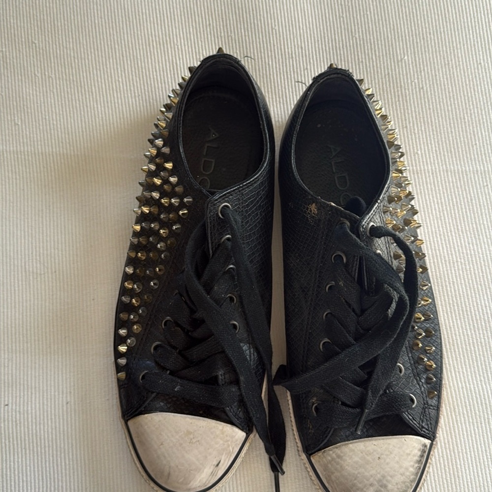 Black sneakers with studs